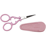 Pink scissors with a matching sheath on a white background